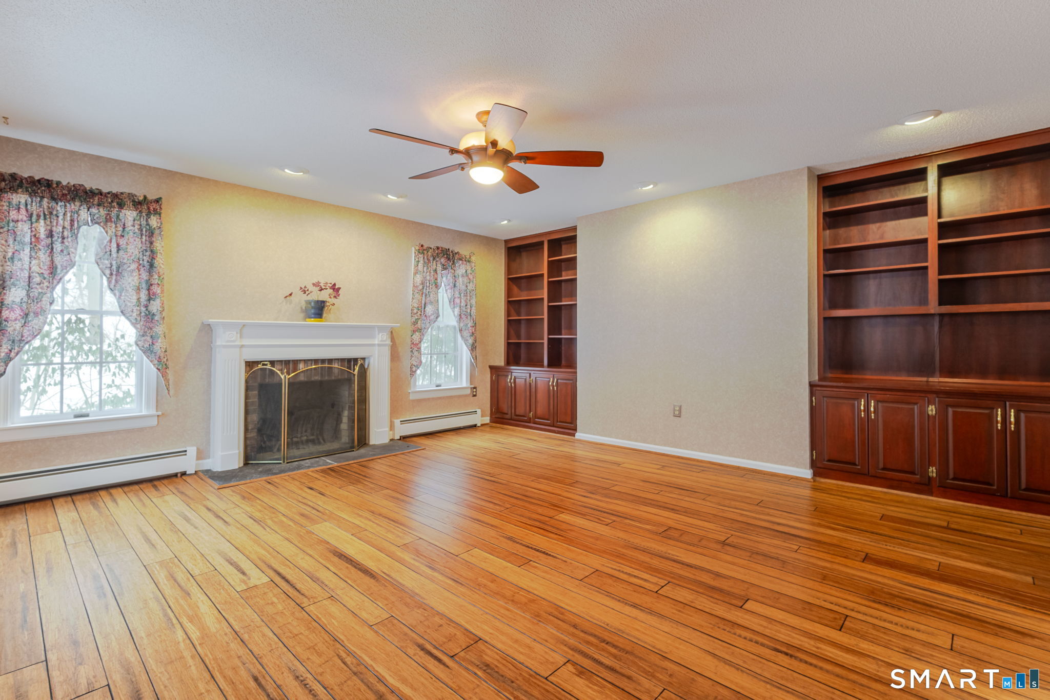 279 Old Mountain Road Southington, CT 06444 - Photo 19 of 37 a view of an empty room with a fireplace and a window