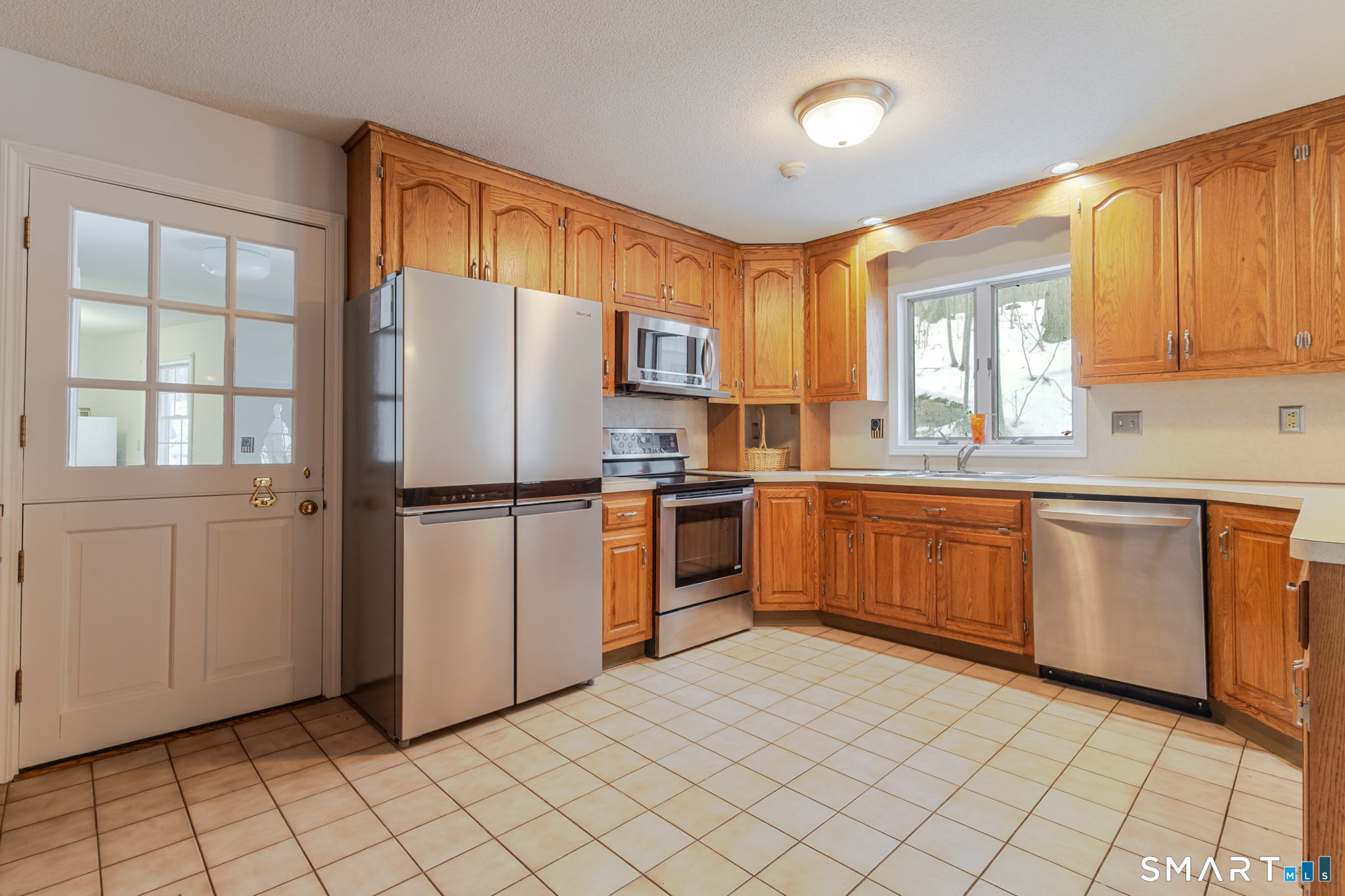 279 Old Mountain Road Southington, CT 06444 - Photo 23 of 37 a kitchen with a refrigerator sink and cabinets