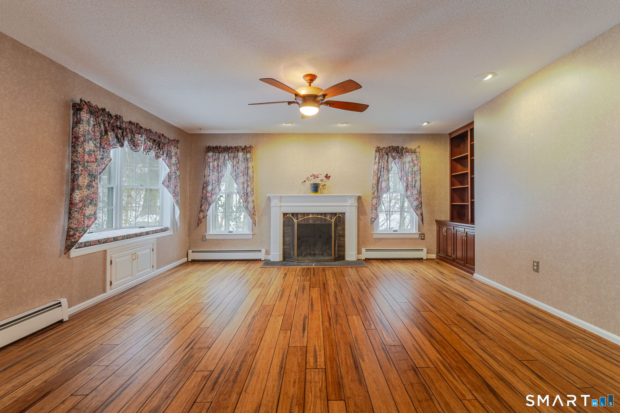 279 Old Mountain Road Southington, CT 06444 - Photo 5 of 37 a view of an empty room with a fireplace and a window