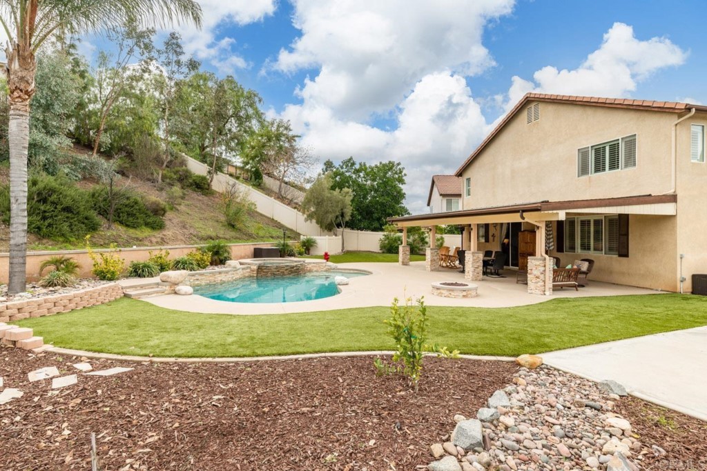 34063 Abbey Road Temecula, CA 92592 - Photo 13 of 33 a view of a house with swimming pool and a yard
