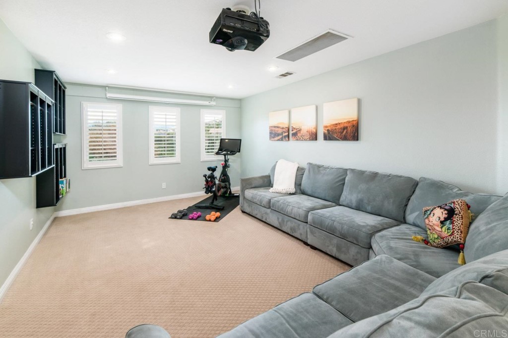 34063 Abbey Road Temecula, CA 92592 - Photo 22 of 33 a living room with furniture and a flat screen tv