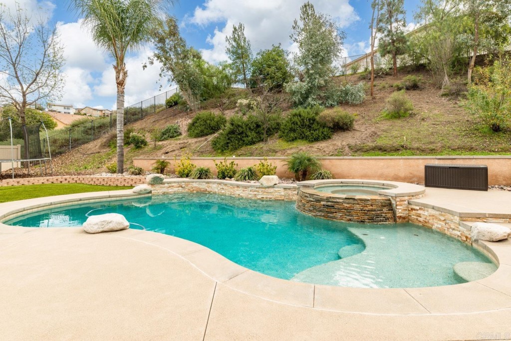 34063 Abbey Road Temecula, CA 92592 - Photo 29 of 33 a view of a swimming pool with a yard
