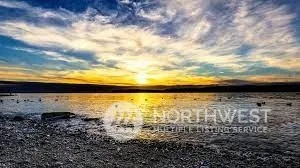 a view of a table and chairs in the garden