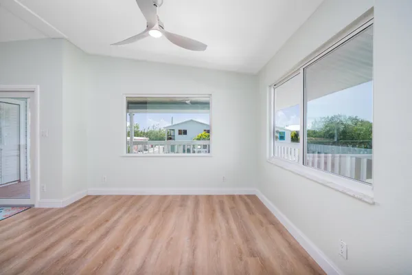 a view of a balcony with wooden floor