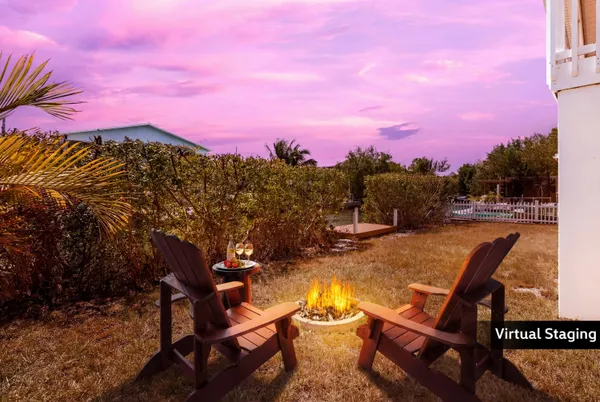 a view of house with outdoor space and swimming pool