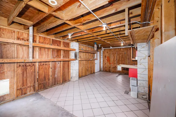 a living room with furniture wooden floor and a window