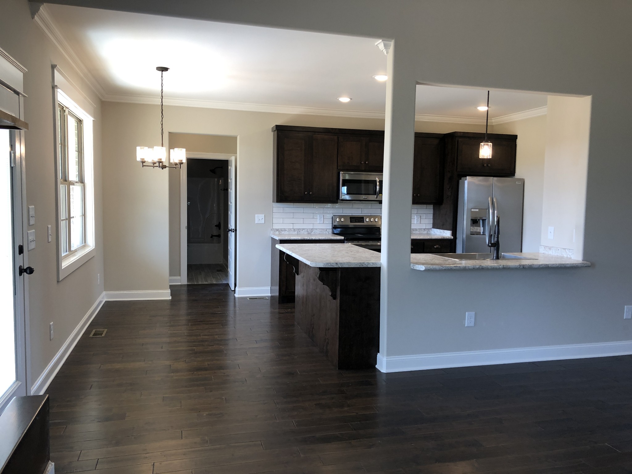 2096 Longview Road Bell Buckle, TN 37020 - Photo 7 of 27 a view of a kitchen with cabinets and stainless steel appliances