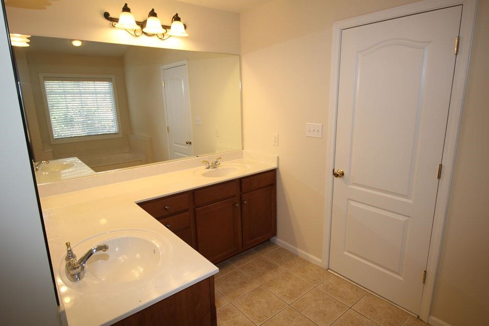 6952 Middleboro Drive Raleigh, NC 27612 - Photo 16 of 32 Master bath with 2 sink vanities, whirlpool tub & separate shower. Master Bathroom