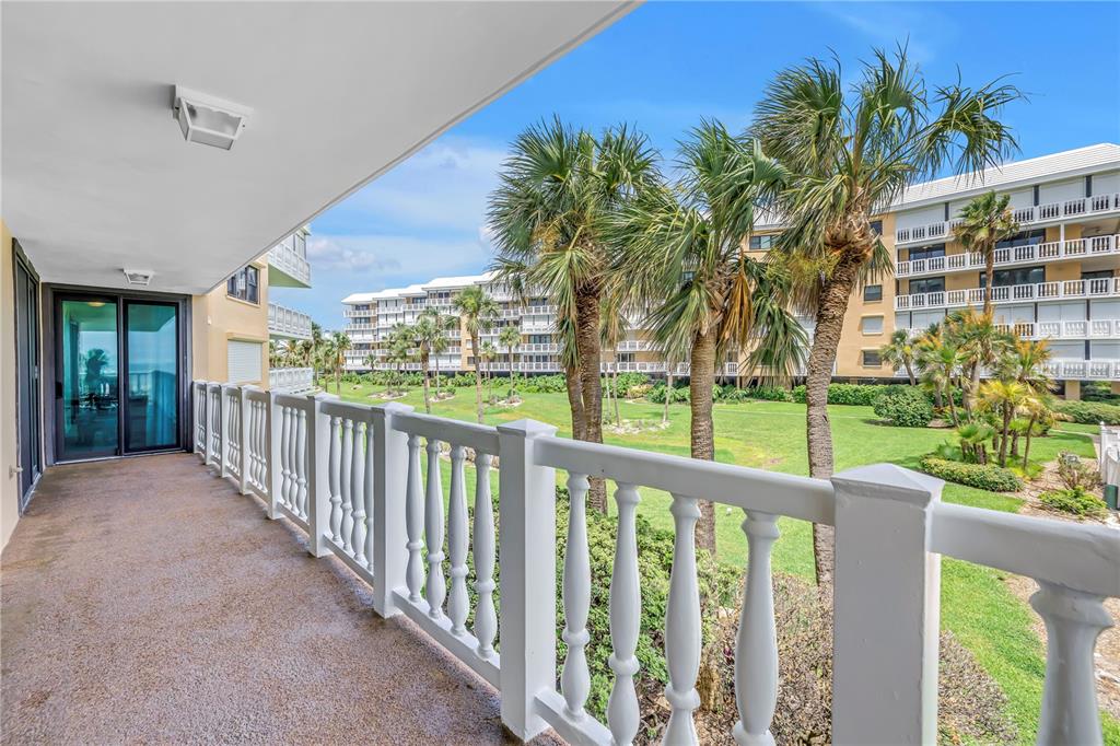 6600 Sunset Way, Unit 118 St. Pete Beach, FL 33706 - Photo 16 of 64 a view of a porch with a backyard