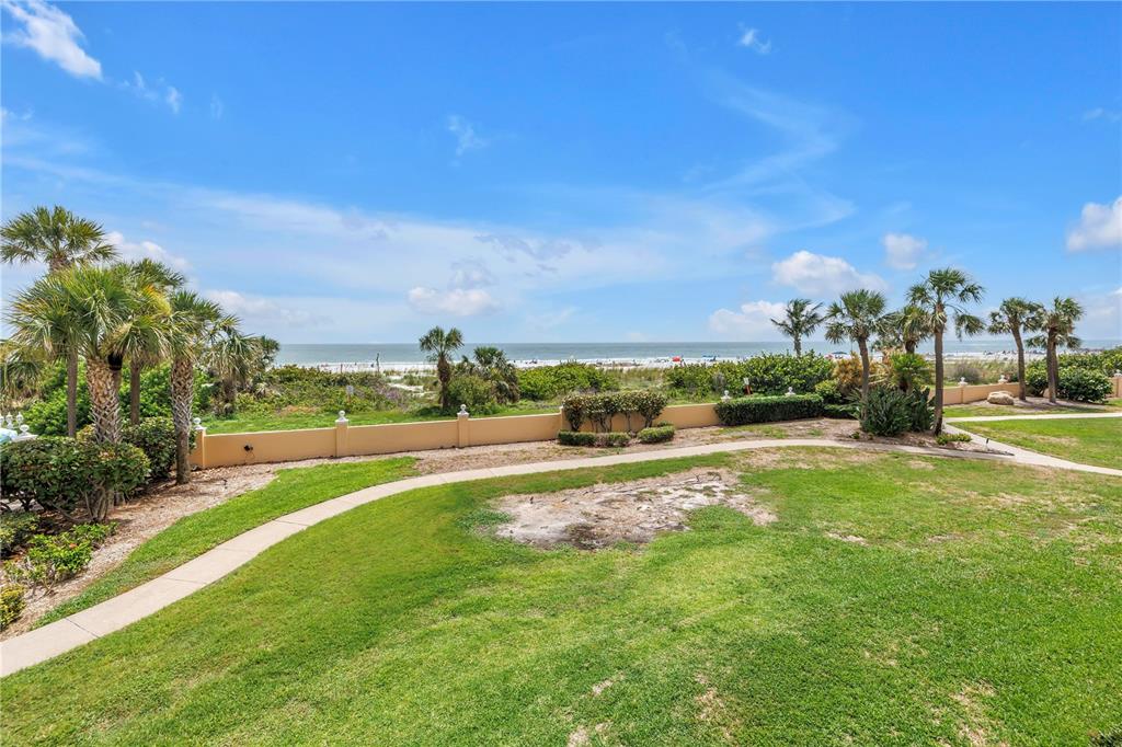 6600 Sunset Way, Unit 118 St. Pete Beach, FL 33706 - Photo 17 of 64 a view of an outdoor space and swimming pool
