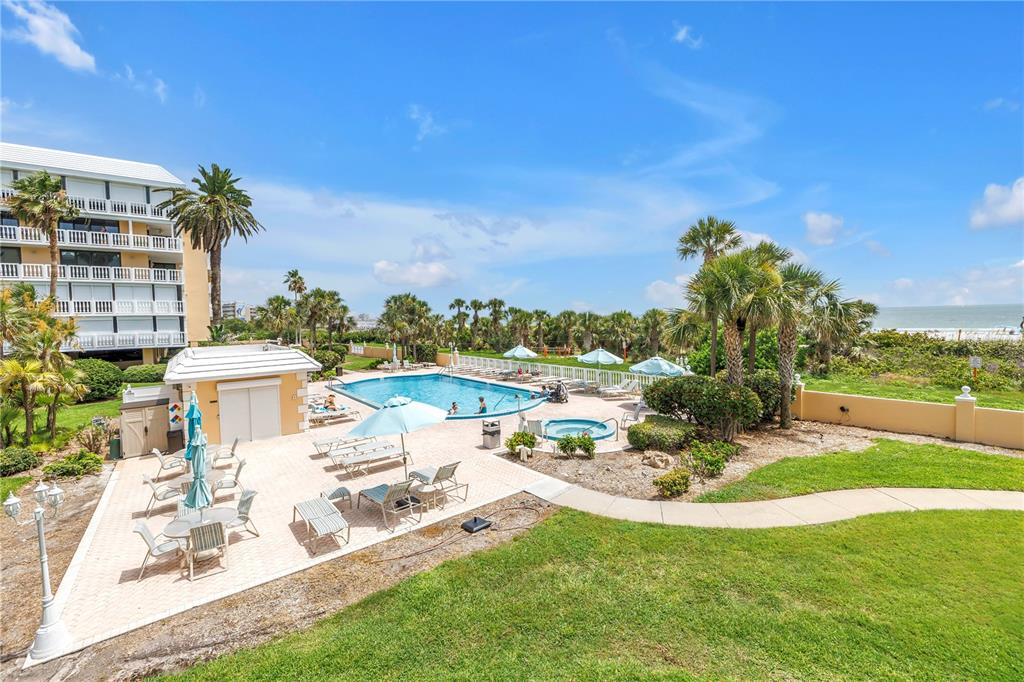 6600 Sunset Way, Unit 118 St. Pete Beach, FL 33706 - Photo 18 of 64 a view of a lake with a house in the background