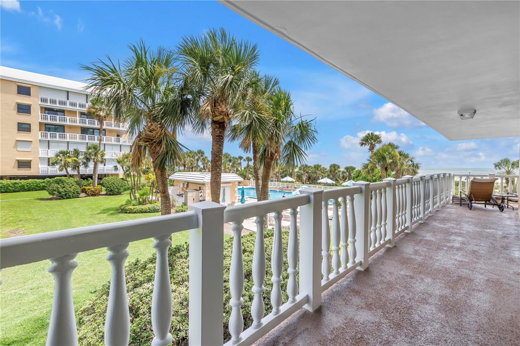 6600 Sunset Way, Unit 118 St. Pete Beach, FL 33706 - Photo 19 of 64 a view of a porch with a yard