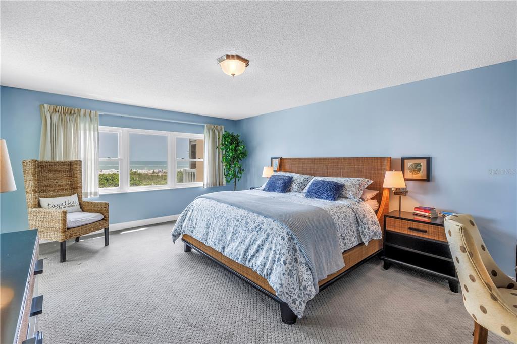 6600 Sunset Way, Unit 118 St. Pete Beach, FL 33706 - Photo 22 of 64 a bedroom with a bed and a window