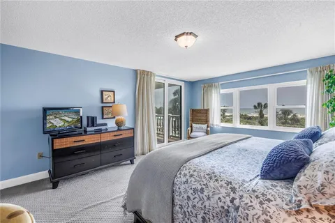 a bathroom with a tub and a mirror
