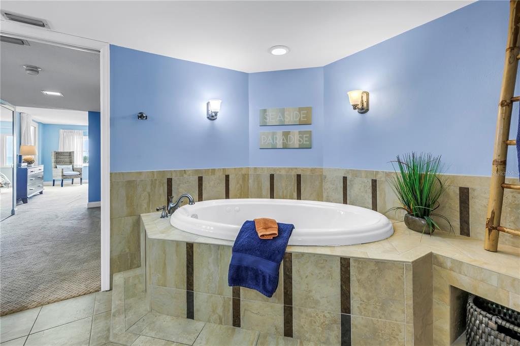 6600 Sunset Way, Unit 118 St. Pete Beach, FL 33706 - Photo 29 of 64 a view of a dining room with furniture and wooden floor