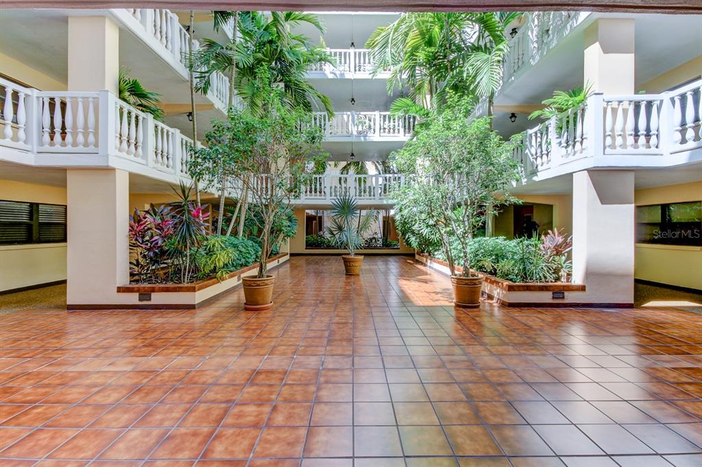6600 Sunset Way, Unit 118 St. Pete Beach, FL 33706 - Photo 3 of 64 a view of an entryway of a house