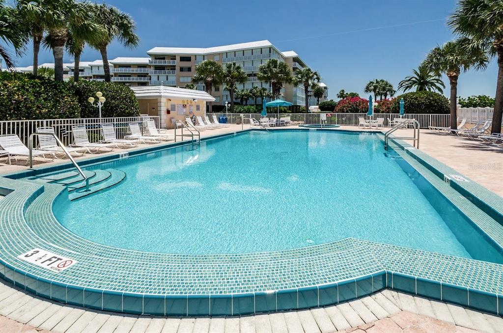 6600 Sunset Way, Unit 118 St. Pete Beach, FL 33706 - Photo 41 of 64 a view of a swimming pool with outdoor seating