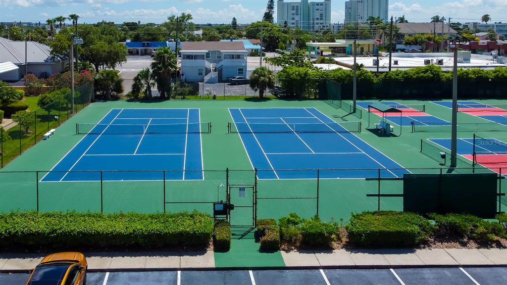 6600 Sunset Way, Unit 118 St. Pete Beach, FL 33706 - Photo 60 of 64 a view of a tennis court