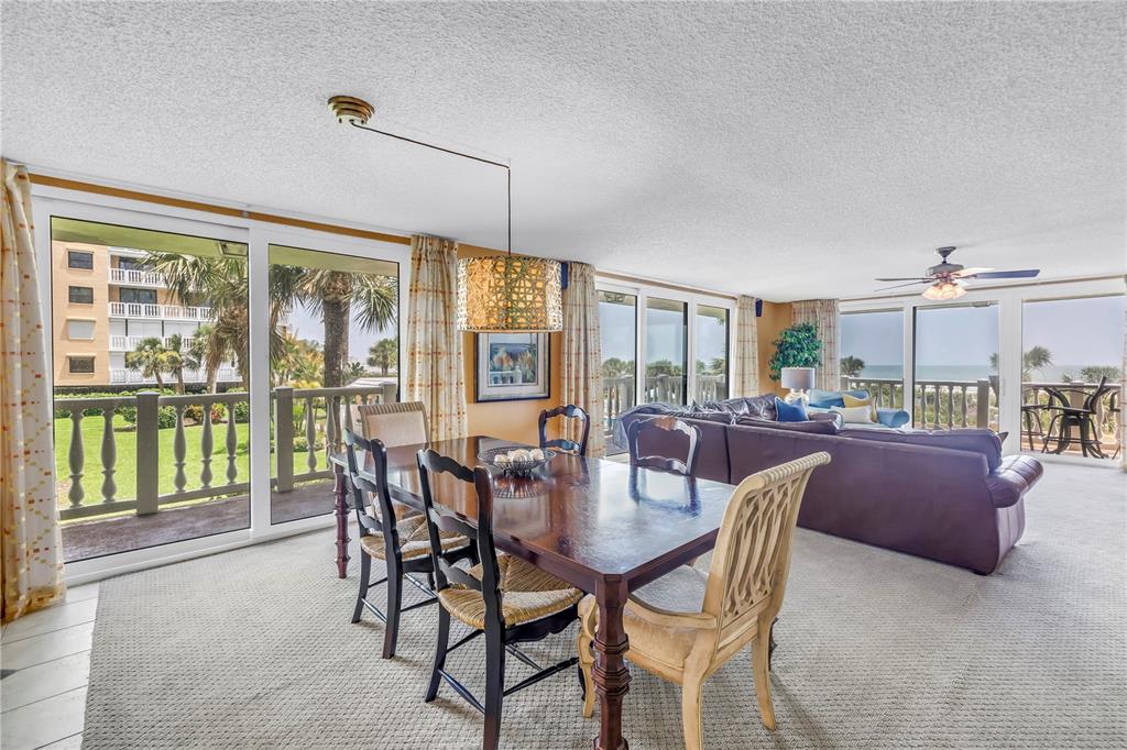 6600 Sunset Way, Unit 118 St. Pete Beach, FL 33706 - Photo 10 of 64 a view of a dining room with furniture window and outside view