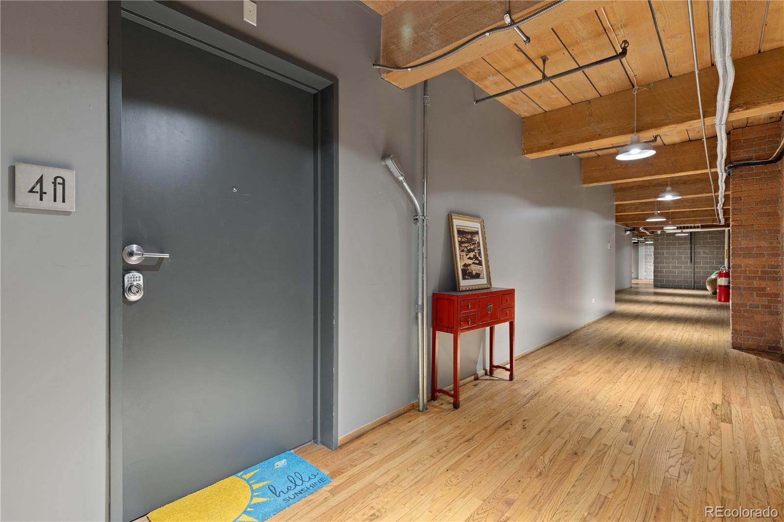 1616 14th Street, Unit 4A Denver, CO 80202 - Photo 11 of 43 a view of a hallway with wooden floor
