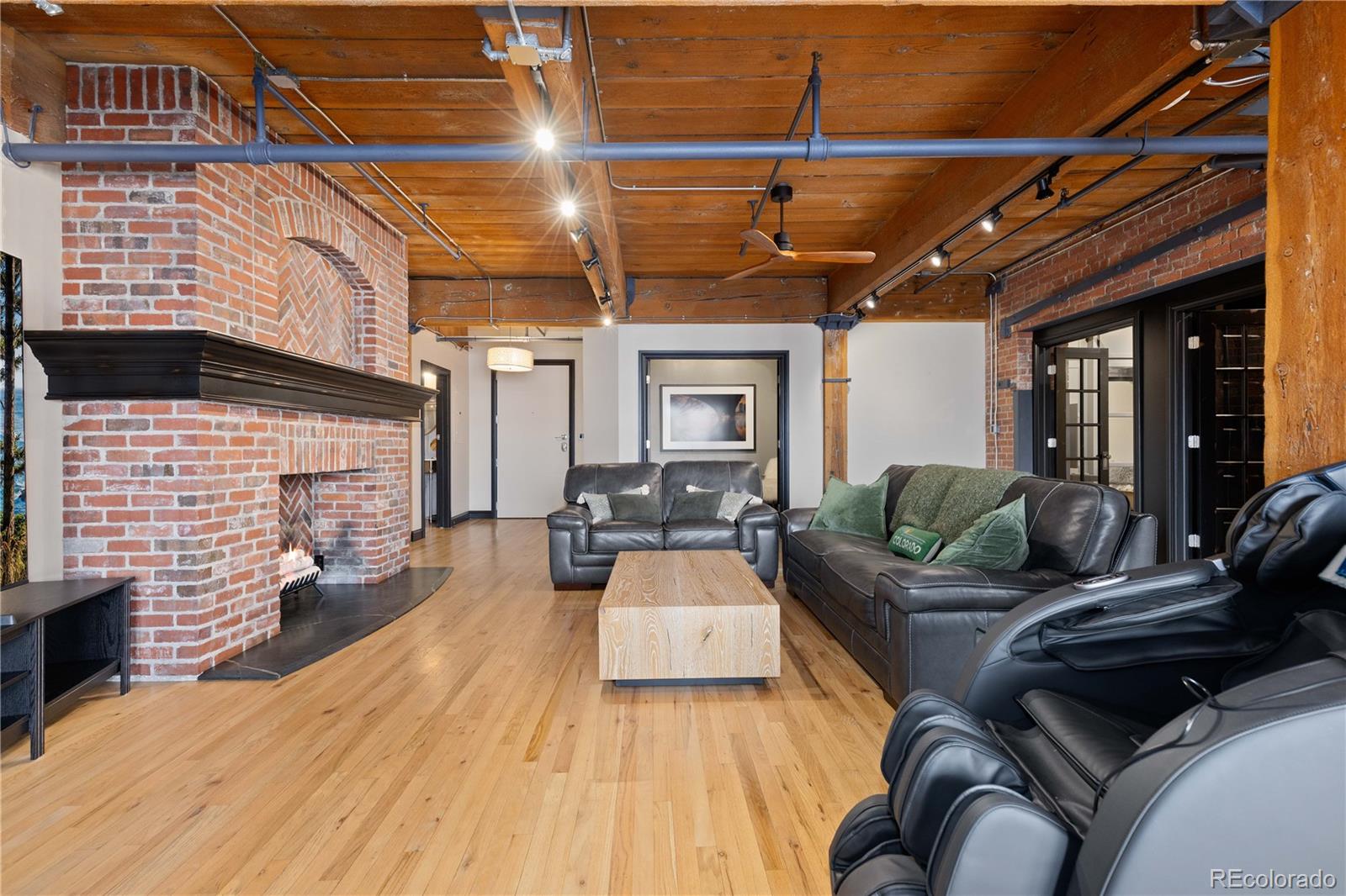 1616 14th Street, Unit 4A Denver, CO 80202 - Photo 13 of 43 a living room with furniture and a fireplace