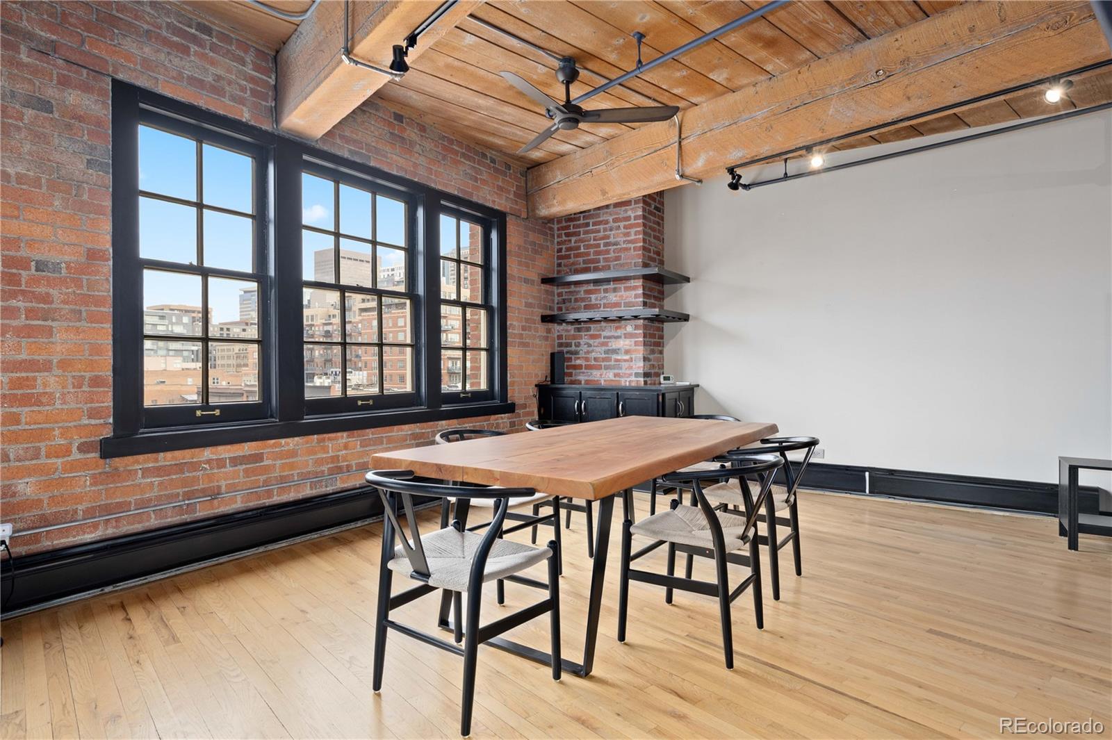 1616 14th Street, Unit 4A Denver, CO 80202 - Photo 15 of 43 a table and chairs in a room next to a window