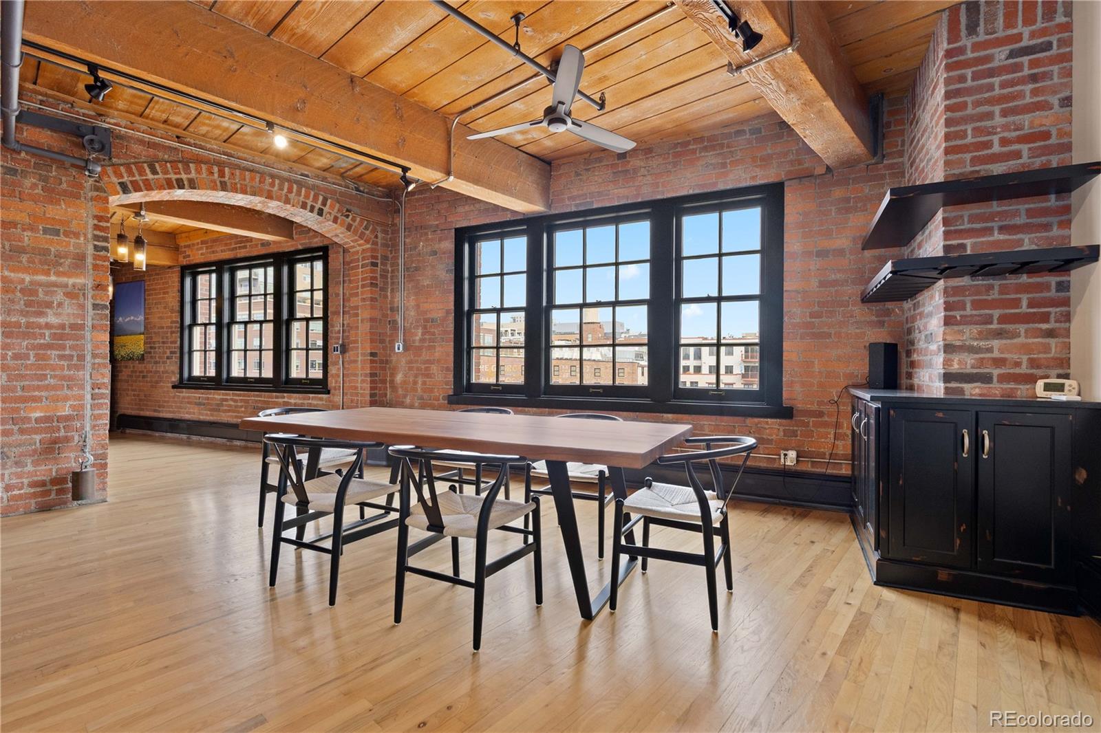 1616 14th Street, Unit 4A Denver, CO 80202 - Photo 16 of 43 a view of a dining room with furniture and wooden floor