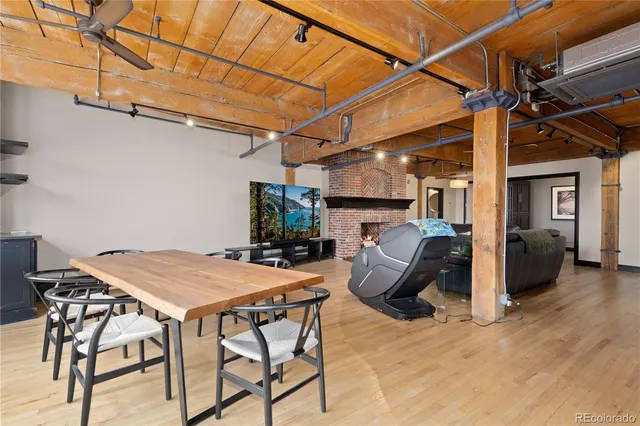 a view of a patio with table and chairs