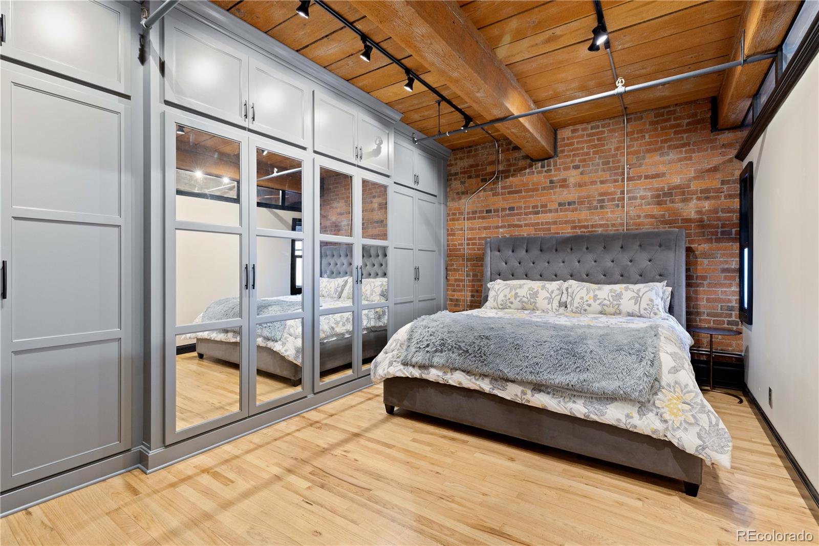 1616 14th Street, Unit 4A Denver, CO 80202 - Photo 22 of 43 a bedroom with a bed and glass door