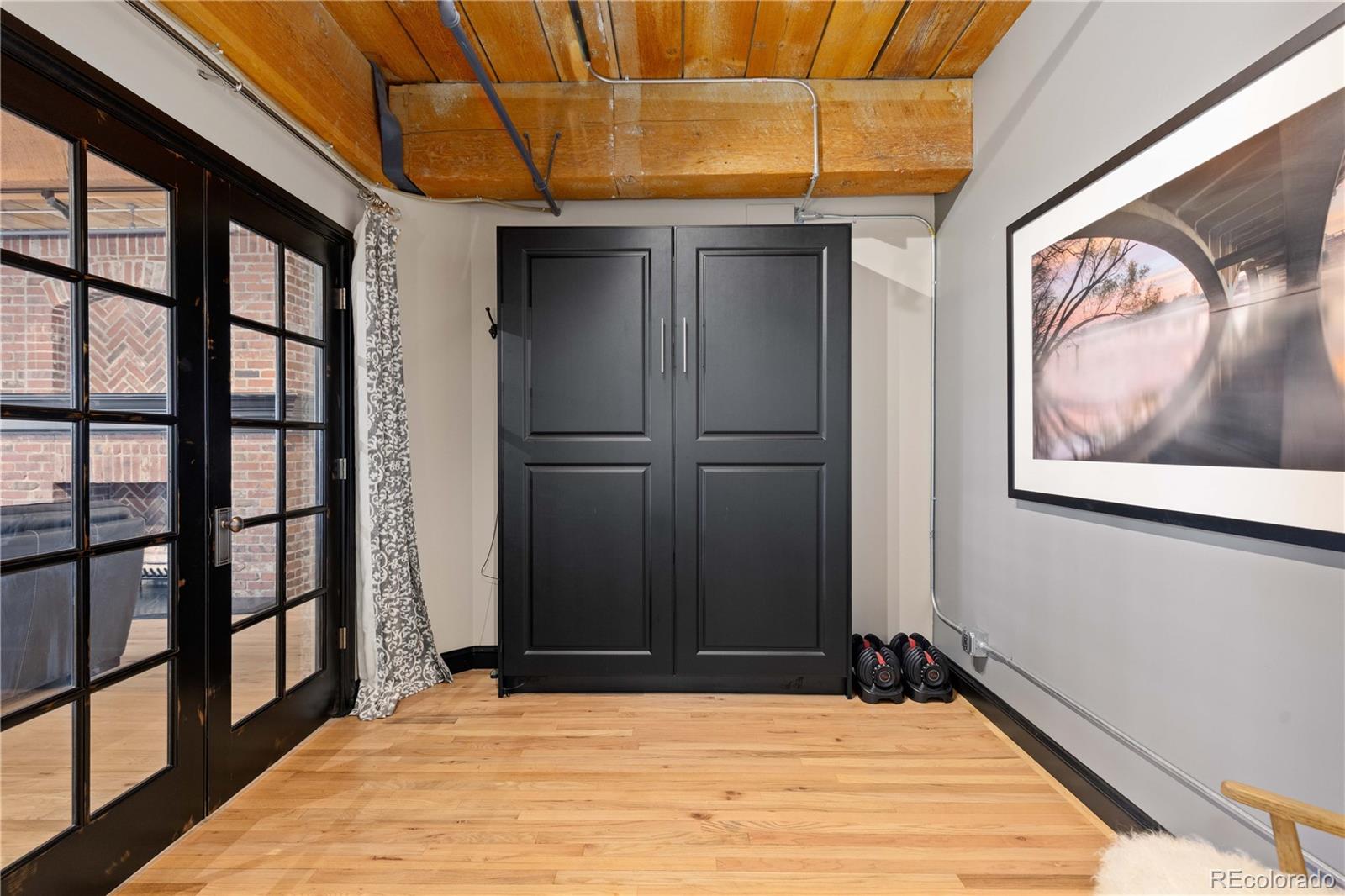 1616 14th Street, Unit 4A Denver, CO 80202 - Photo 26 of 43 a view of empty room with wooden floor and fan