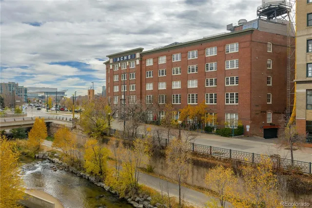 a view of swimming pool with outdoor seating and plants