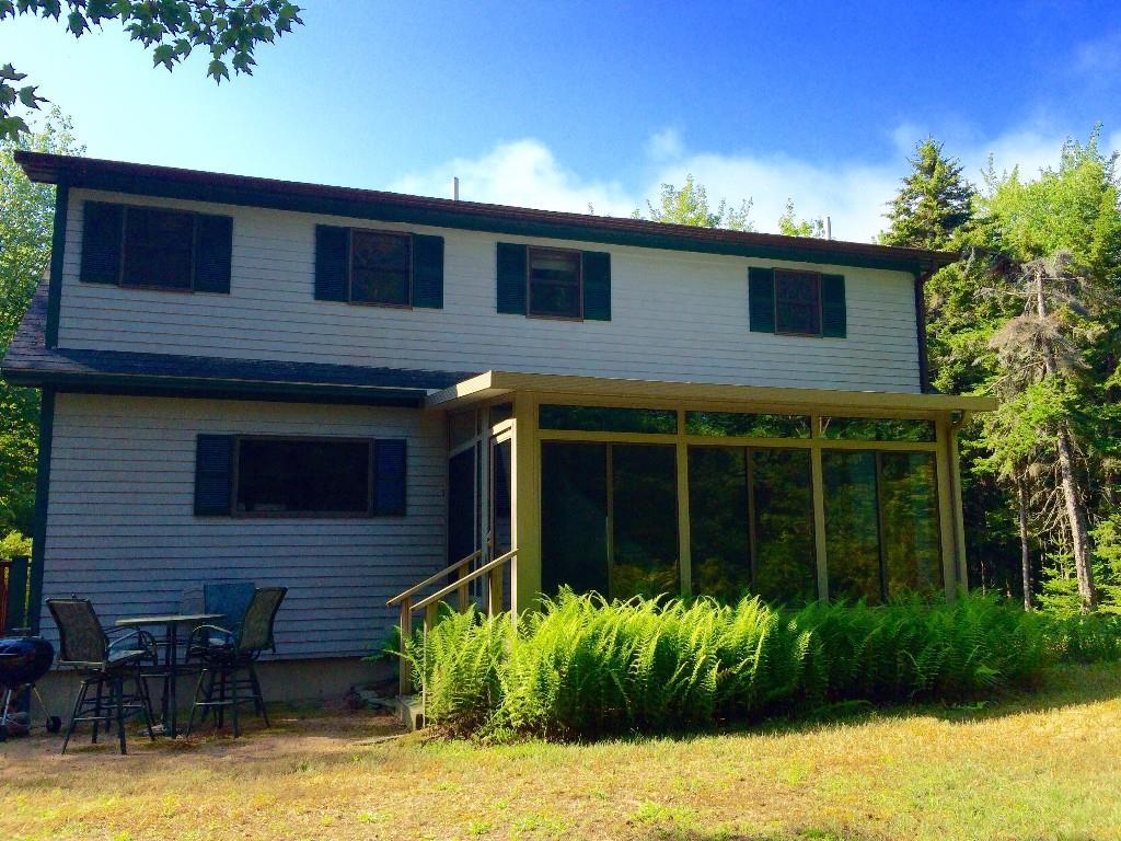 884 Tremont Road Bernard, ME 04612 - Photo 4 of 24 Exterior rear of home lined with...