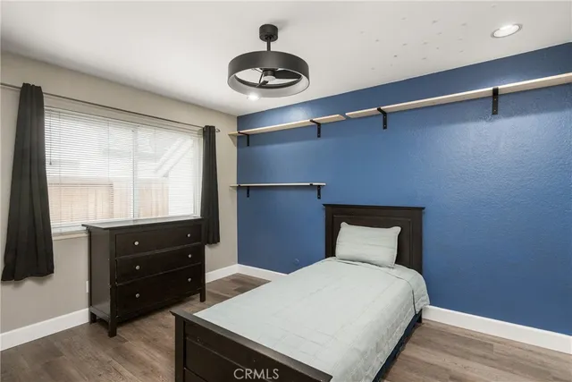 a bedroom with a bed and a closet