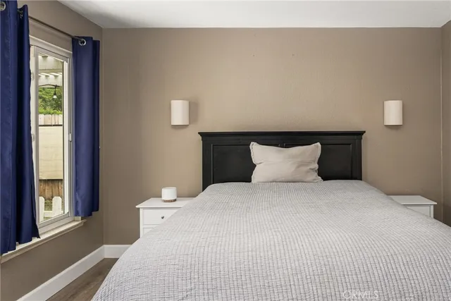 a bedroom with a bed and window