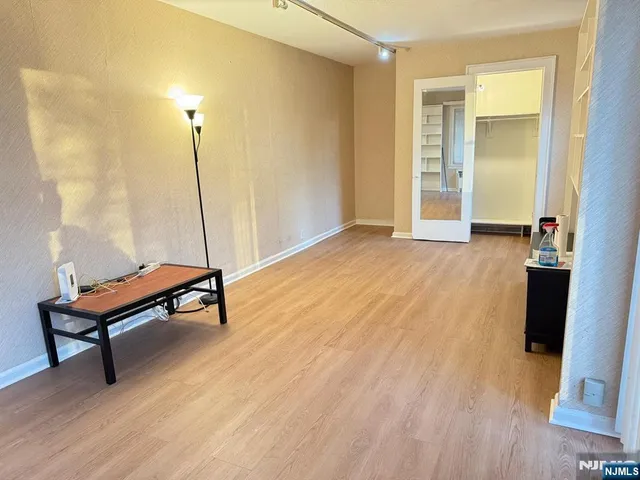 a bench sitting in a room next to a window