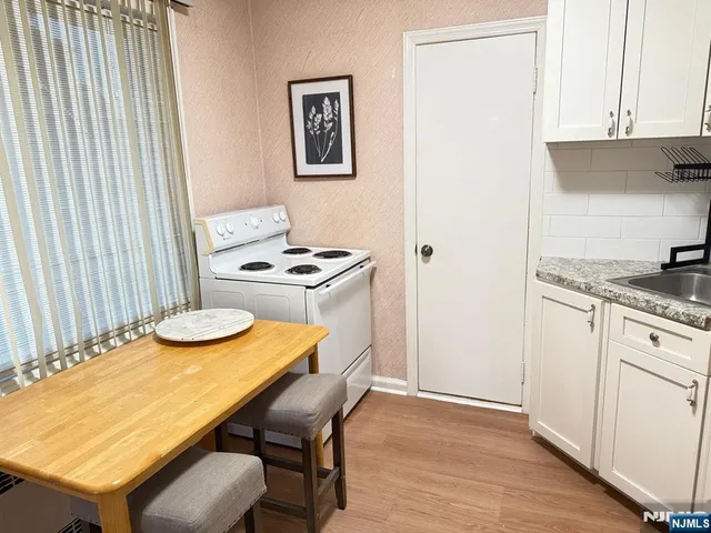 a kitchen with a table and chairs in it