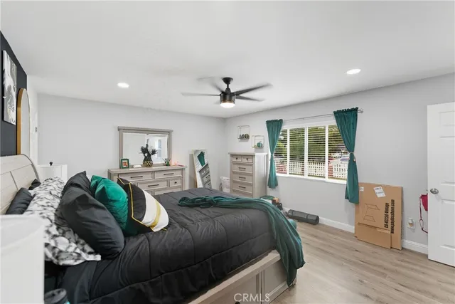 a spacious bedroom with a large bed and a window