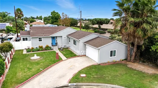 a aerial view of a house with a yard