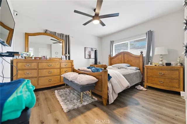 a bedroom with a bed and a dresser