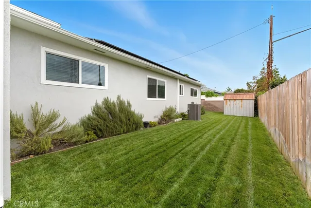 a house view with a backyard space