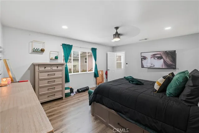 a bedroom with a bed and a dresser