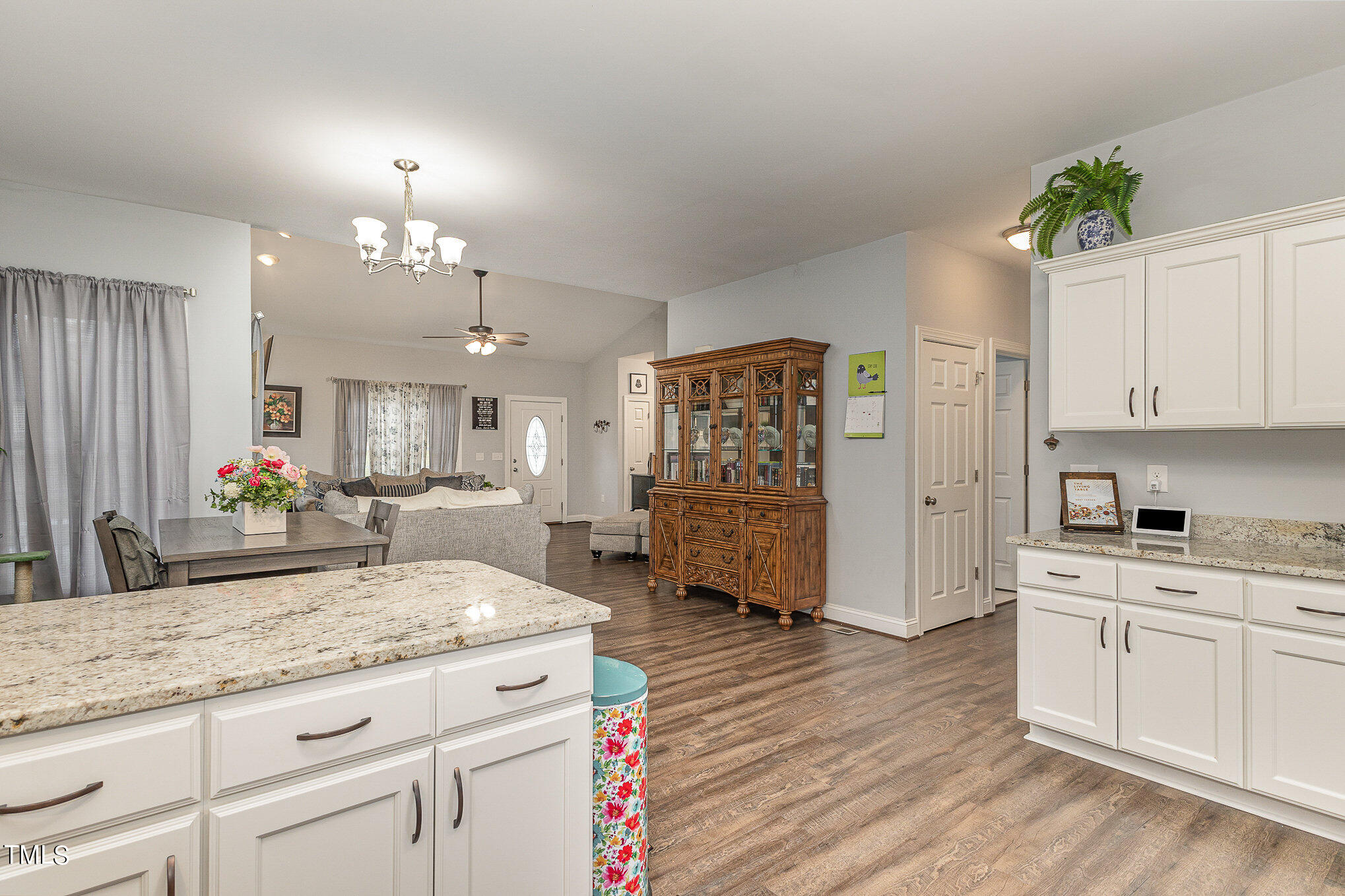 107 Piney Forest Road Roxboro, NC 27574 - Photo 11 of 27 a spacious bathroom with a granite countertop sink a mirror and a shower
