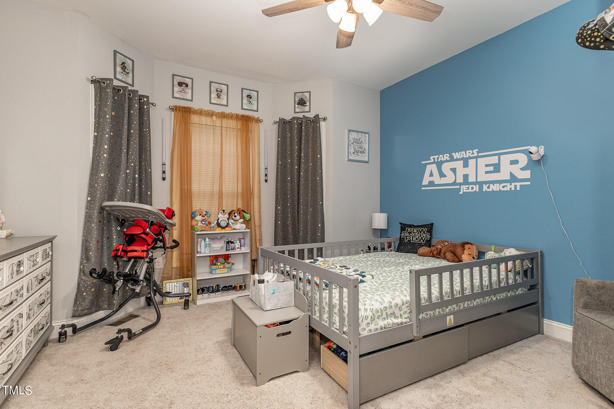 107 Piney Forest Road Roxboro, NC 27574 - Photo 13 of 27 a bed room with a bed and a chandelier