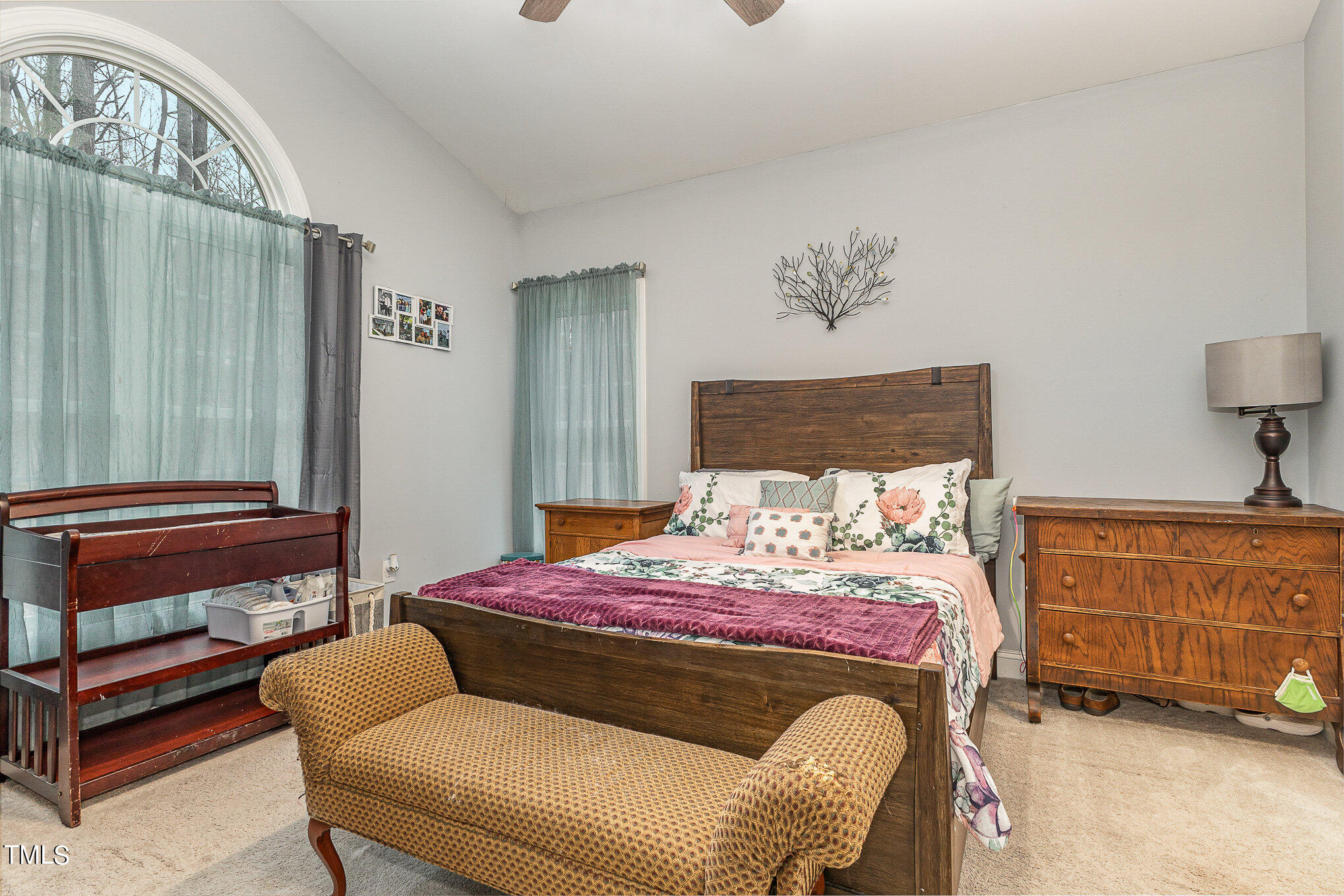 107 Piney Forest Road Roxboro, NC 27574 - Photo 17 of 27 a bedroom with a bed a couch and dresser