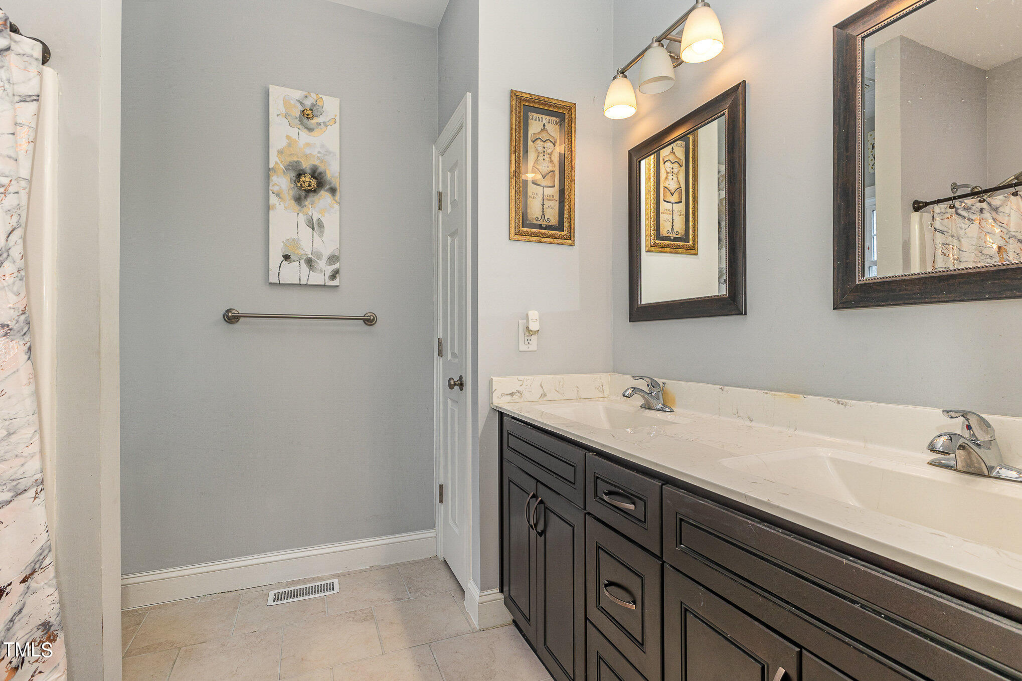 107 Piney Forest Road Roxboro, NC 27574 - Photo 20 of 27 a bathroom with a sink and a mirror