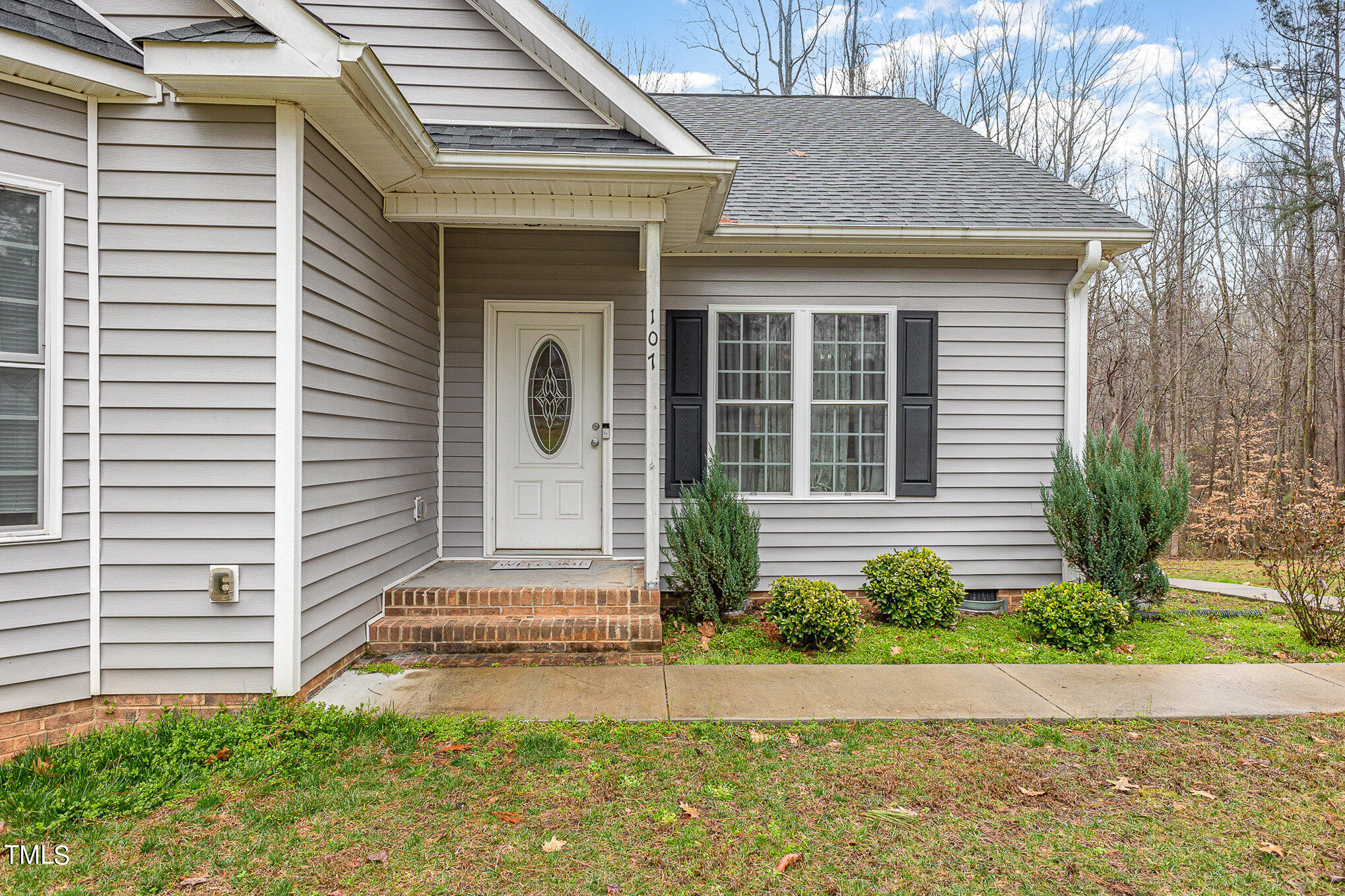 107 Piney Forest Road Roxboro, NC 27574 - Photo 2 of 27 a front view of a house with garden
