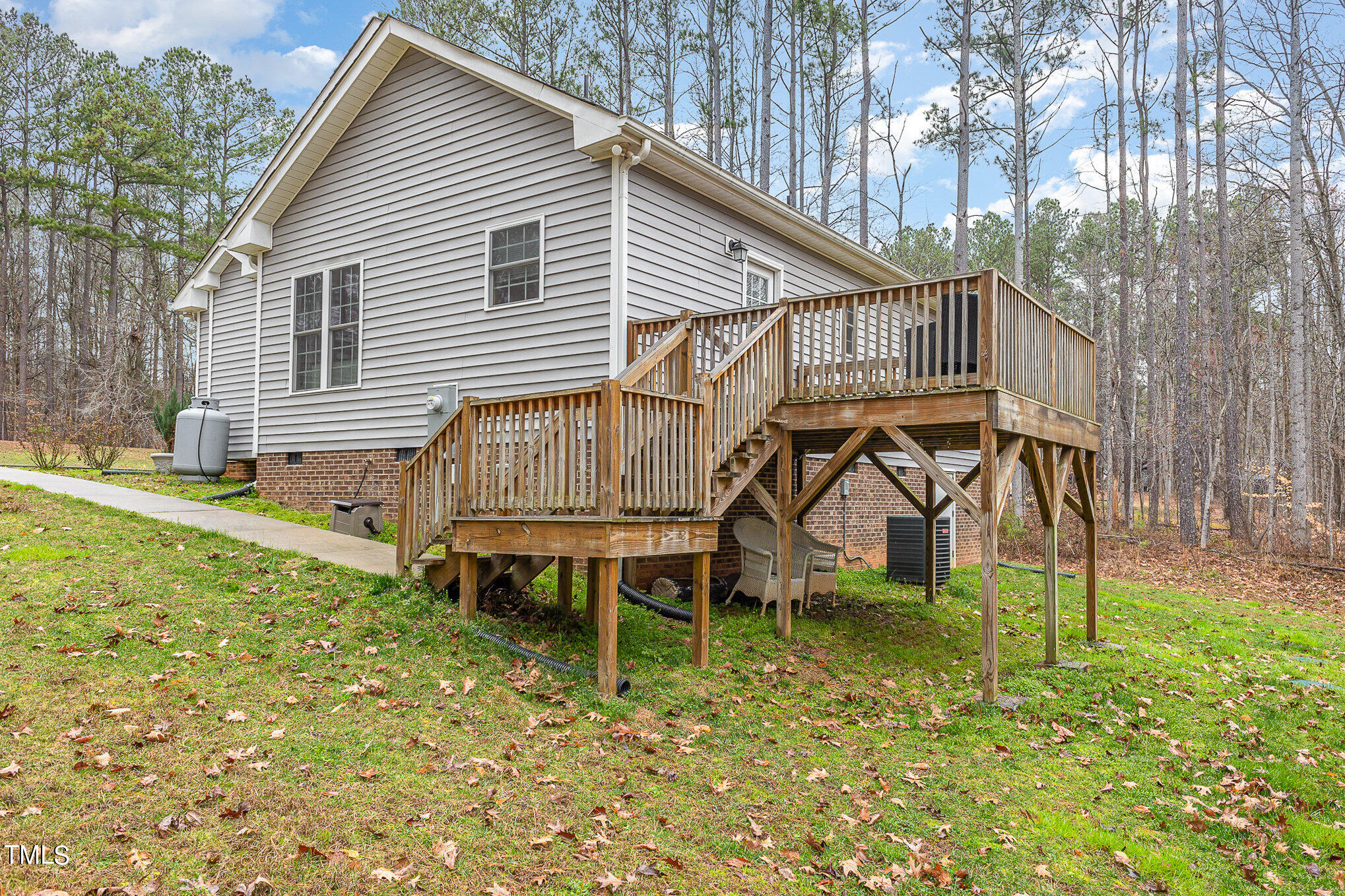 107 Piney Forest Road Roxboro, NC 27574 - Photo 21 of 27 a view of a house with backyard and trees