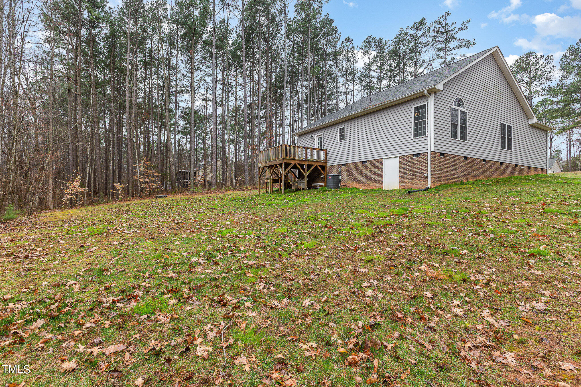 107 Piney Forest Road Roxboro, NC 27574 - Photo 23 of 27 a view of a house with a yard