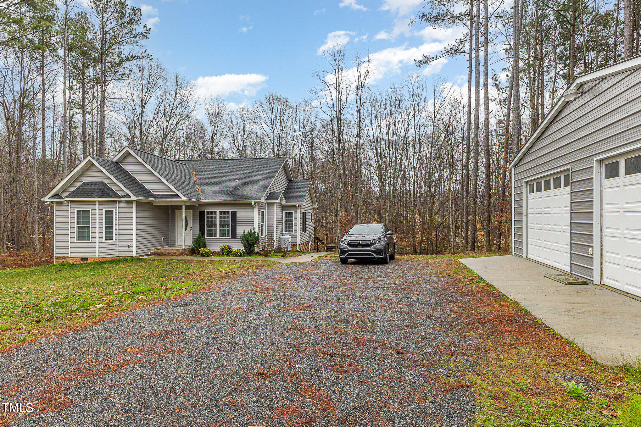 107 Piney Forest Road Roxboro, NC 27574 - Photo 25 of 27 a view of a house with backyard and garden