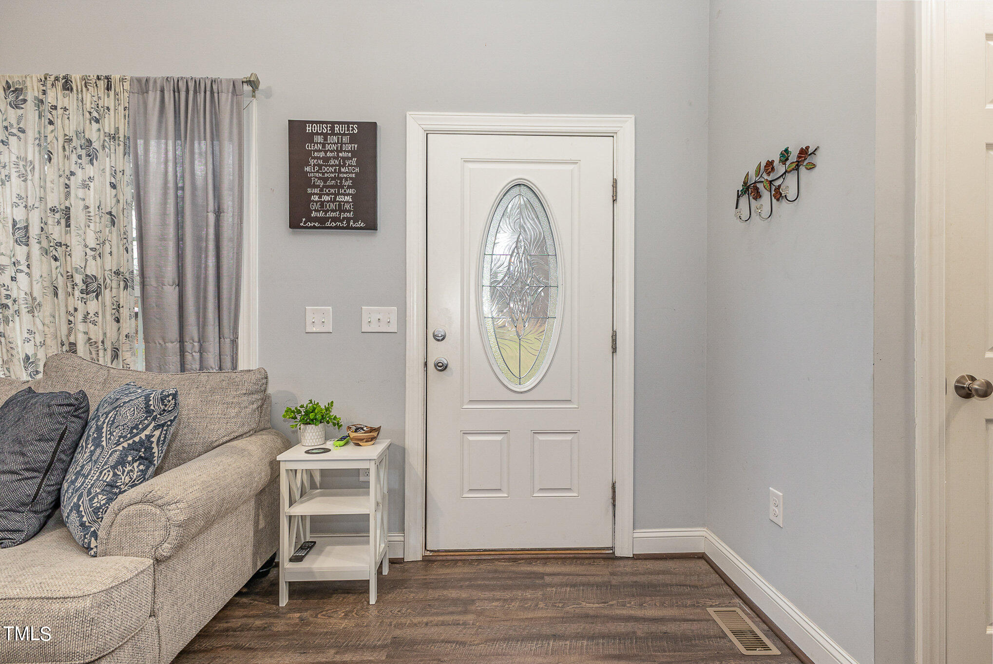 107 Piney Forest Road Roxboro, NC 27574 - Photo 4 of 27 a view of a livingroom with furniture and wooden floor